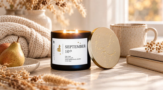September 10 Cosmic Birthday Candle styled in a warm early-fall home setting with tea, books, pears, and soft natural light.